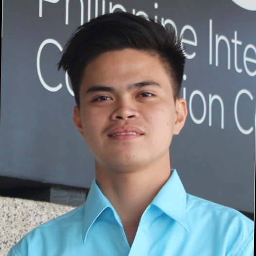 Portrait of Ralph Angelo Mangyao, Public Relations and Communication Assistant at the National Bureau of Investigation, supporting client data accuracy and applicant communication for NBI Clearance Online.
